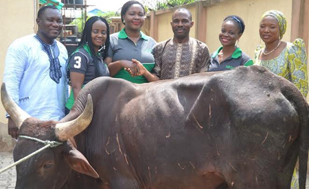 OrijoReporter.com Presentation of a cow to the winner of Heritage Bank Mobile Christmas give away