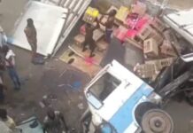 Truck falls off Lagos bridge, lands on bus station