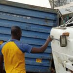 LAGOS TRAGEDY! MOTHER, CHILD CRUSHED TO DEATH AS TWO CONTAINER TRUCKS OVERTURN